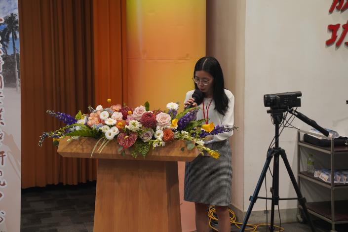 The emcee presiding at one of the conference sessions