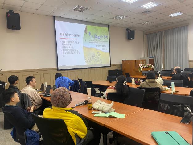 Audience members listening to the presentation by PhD candidate Wenfei Wan